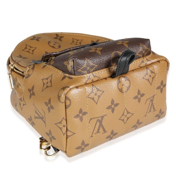 117602 clasp f65f4c2e 4f63 40ee 8104 30e551200473 Louis Vuitton Monogram  Monogram Reverse Canvas Palm Springs Mini Backpack