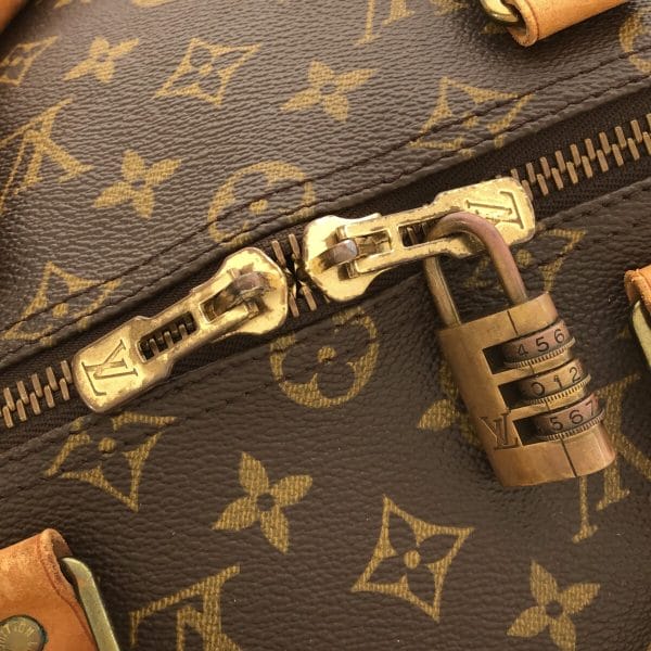 37214120 11 Louis Vuitton Keepall Monogram Canvas Boston Bag Brown